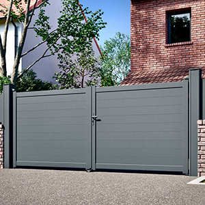 Isofaps pose de portes de garage électriques sectionnelles avec portillon optionnel.